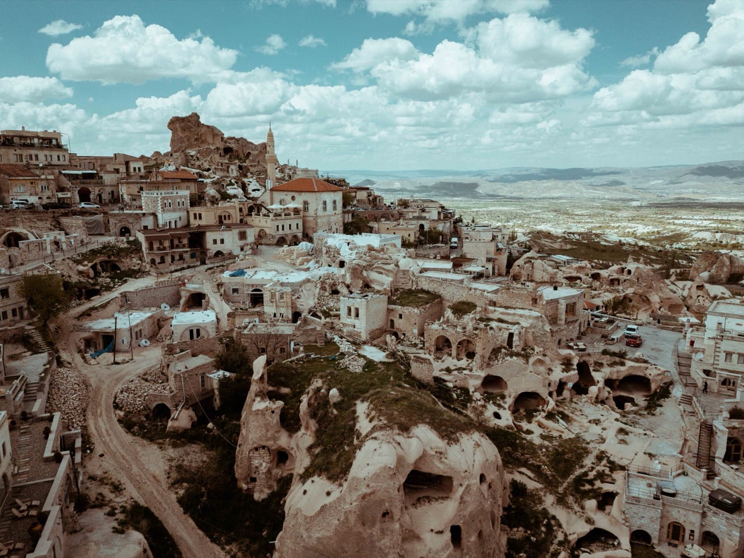 The historic cave town and Uçhisar castle under dramatic cloud